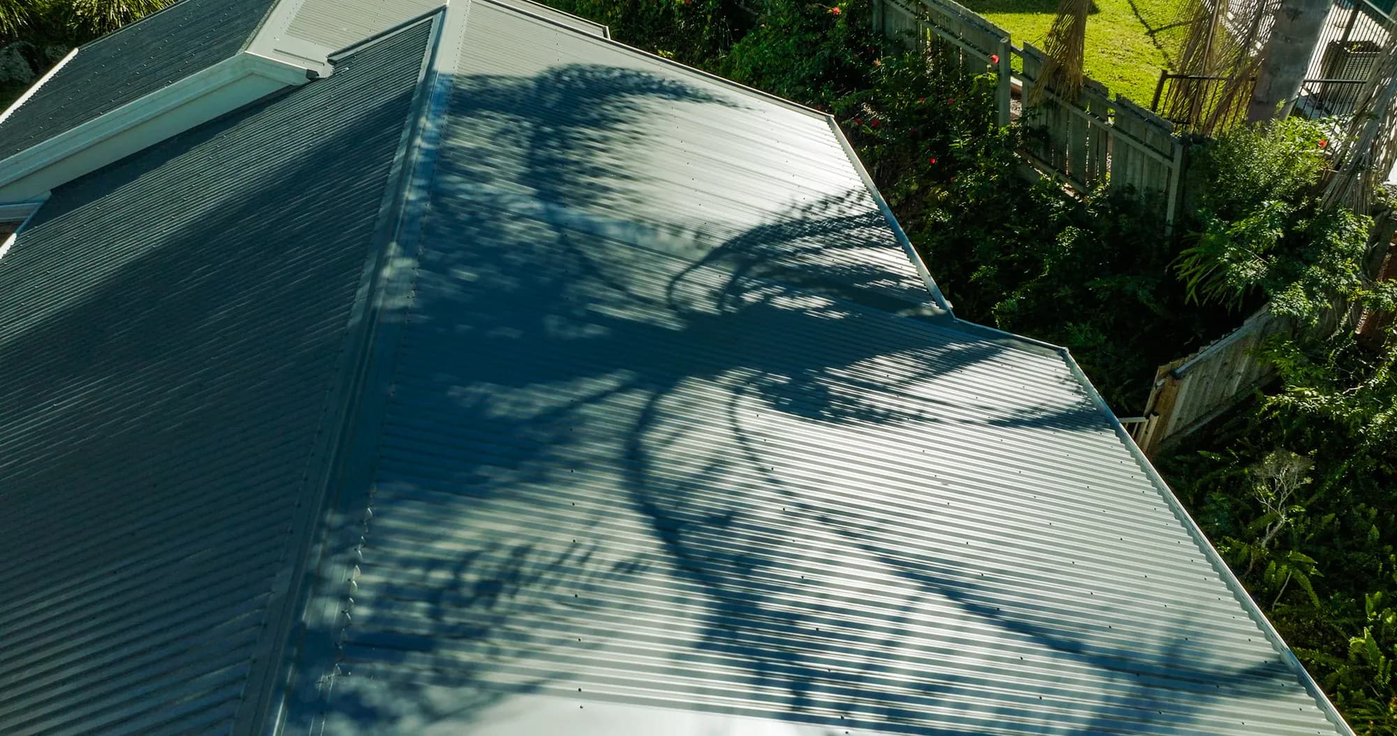 Aerial view of the new COLORBOND Custom Orb roof on the multi-level Benowa home