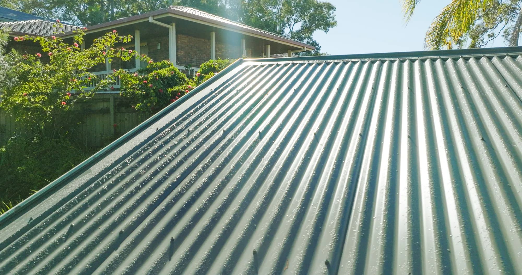 Aerial view of the new COLORBOND Custom Orb roof on the multi-level Benowa home