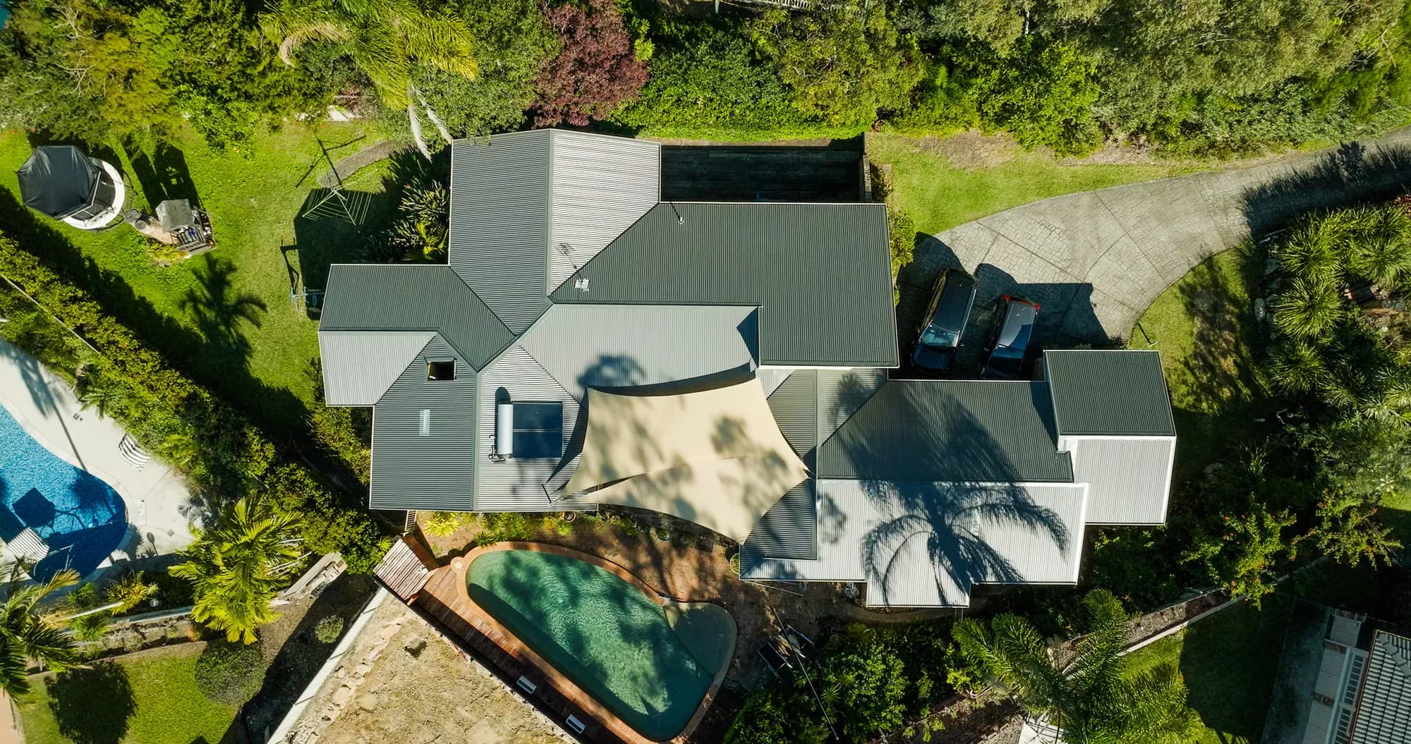 Aerial view of the new COLORBOND Custom Orb roof on the multi-level Benowa home