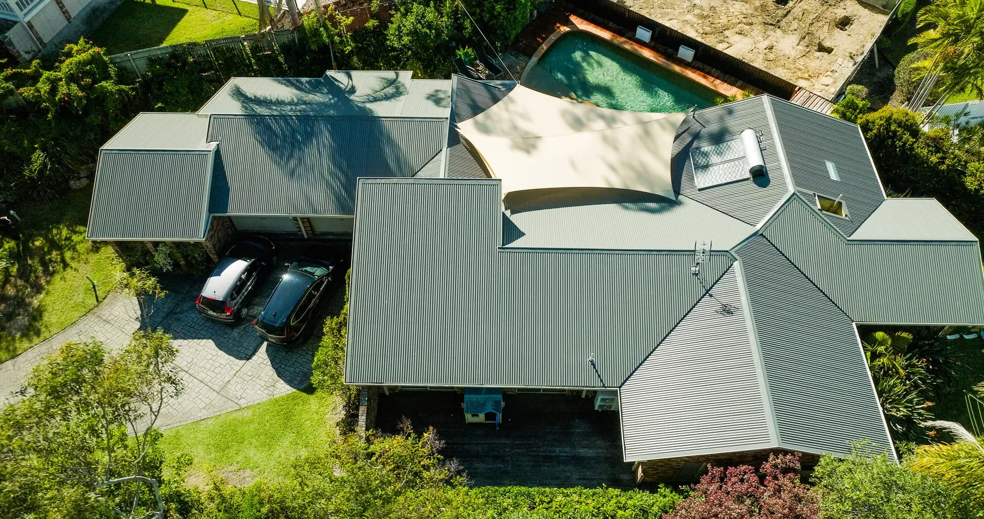 Aerial view of the new COLORBOND Custom Orb roof on the multi-level Benowa home