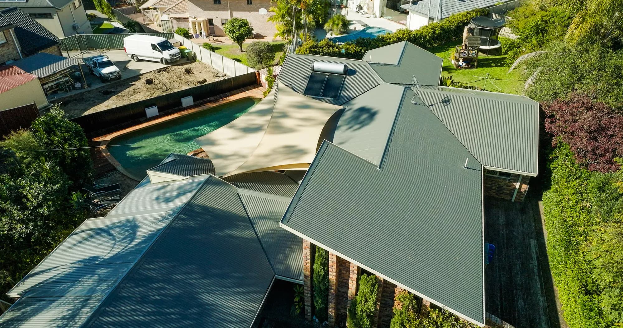 Aerial view of the new COLORBOND Custom Orb roof on the multi-level Benowa home