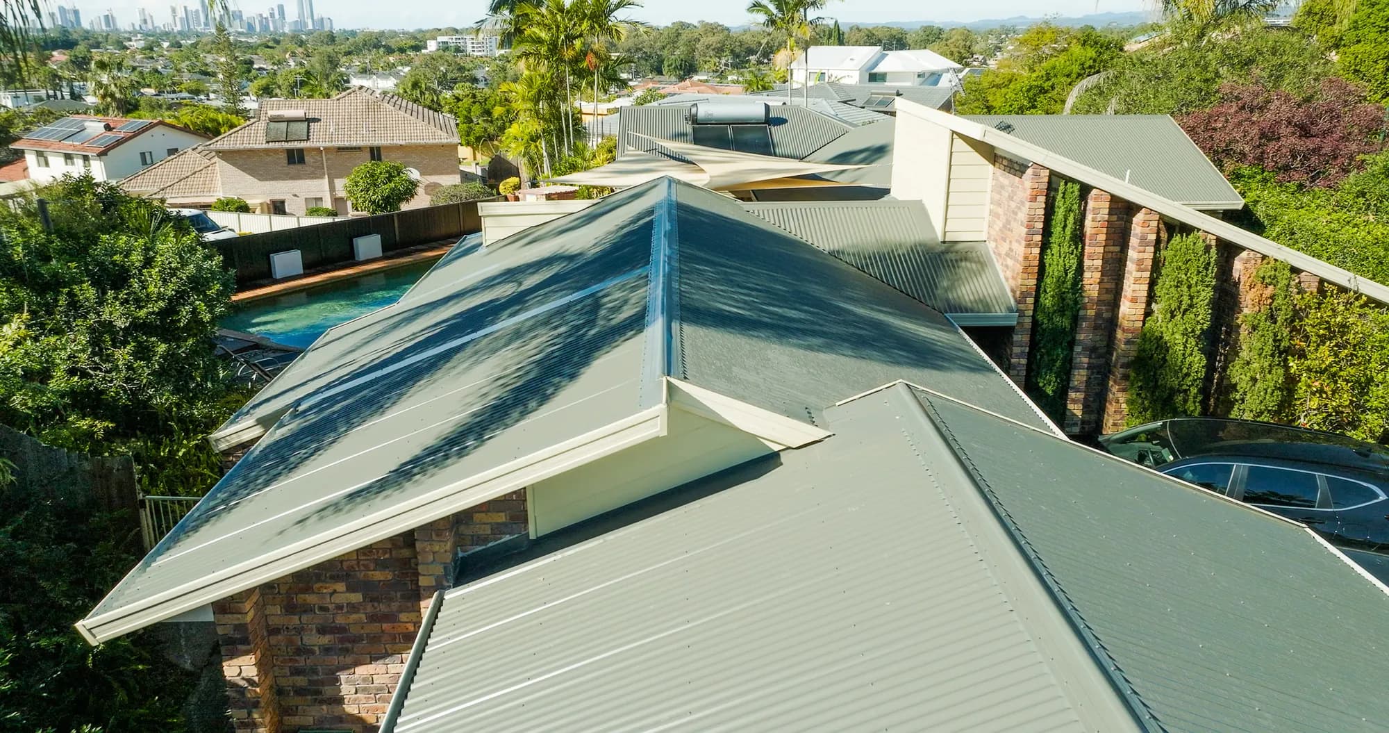 Aerial view of the new COLORBOND Custom Orb roof on the multi-level Benowa home