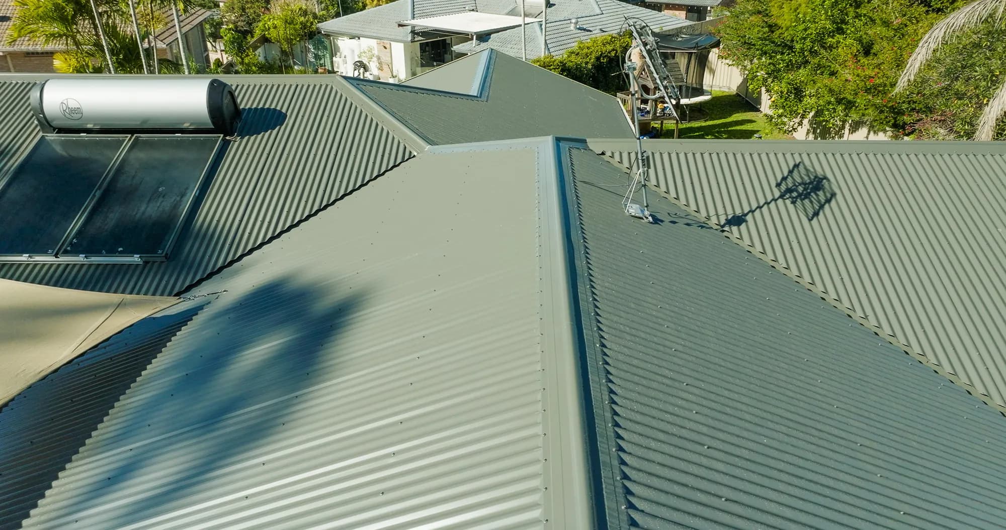 Aerial view of the new COLORBOND Custom Orb roof on the multi-level Benowa home