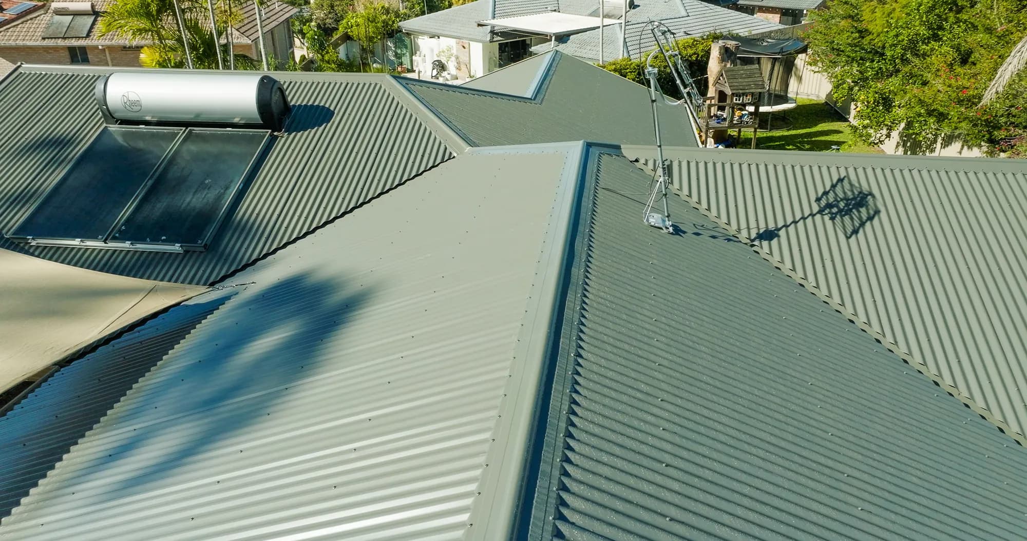 Aerial view of the new COLORBOND Custom Orb roof on the multi-level Benowa home