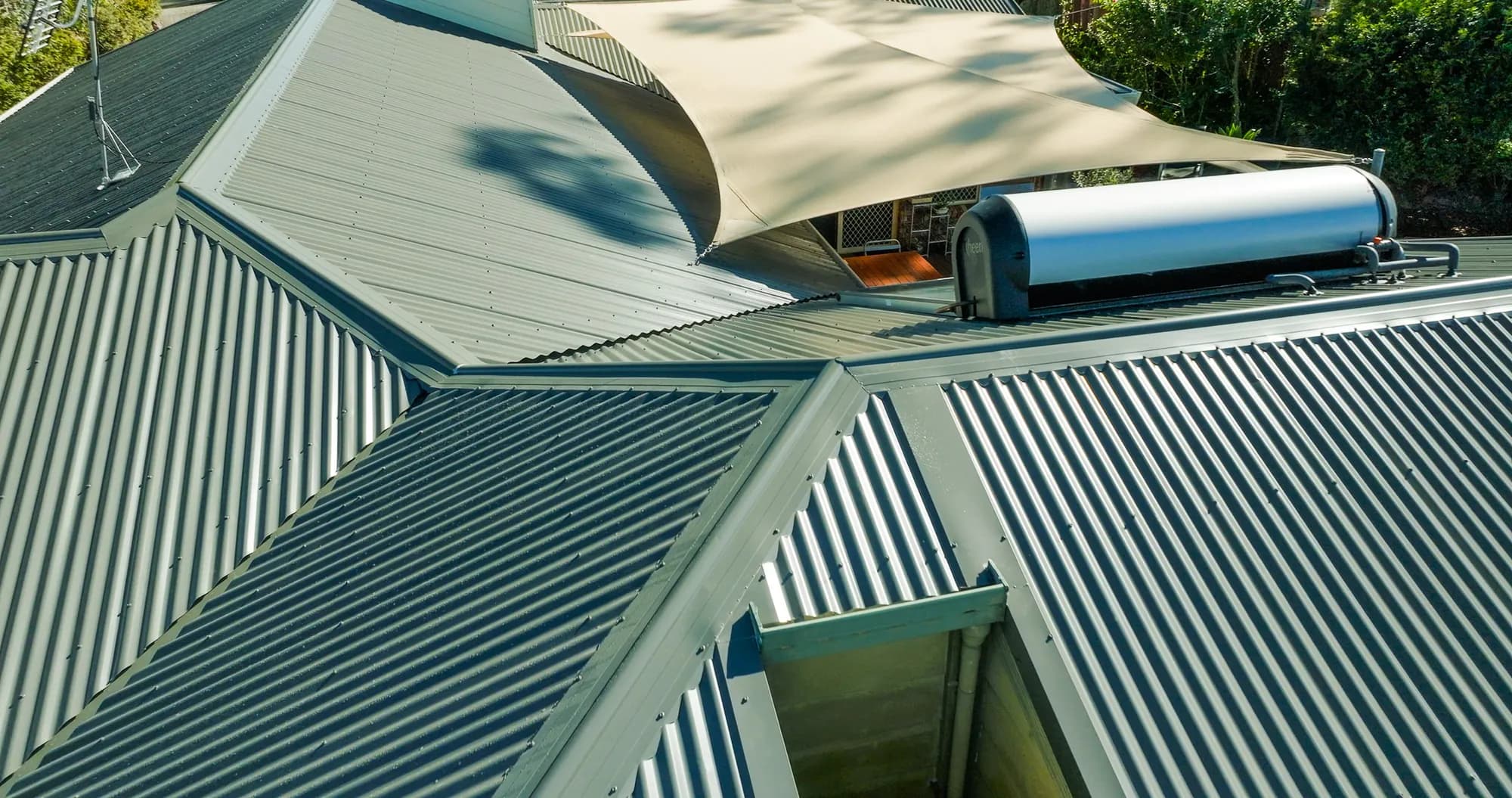 Aerial view of the new COLORBOND Custom Orb roof on the multi-level Benowa home