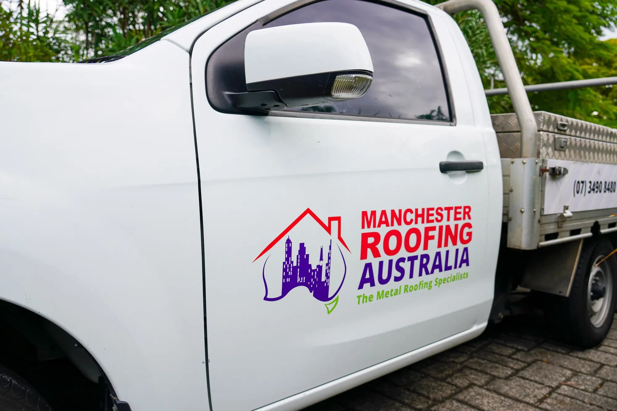 Manchester Roofing Australia work ute on site at Benowa