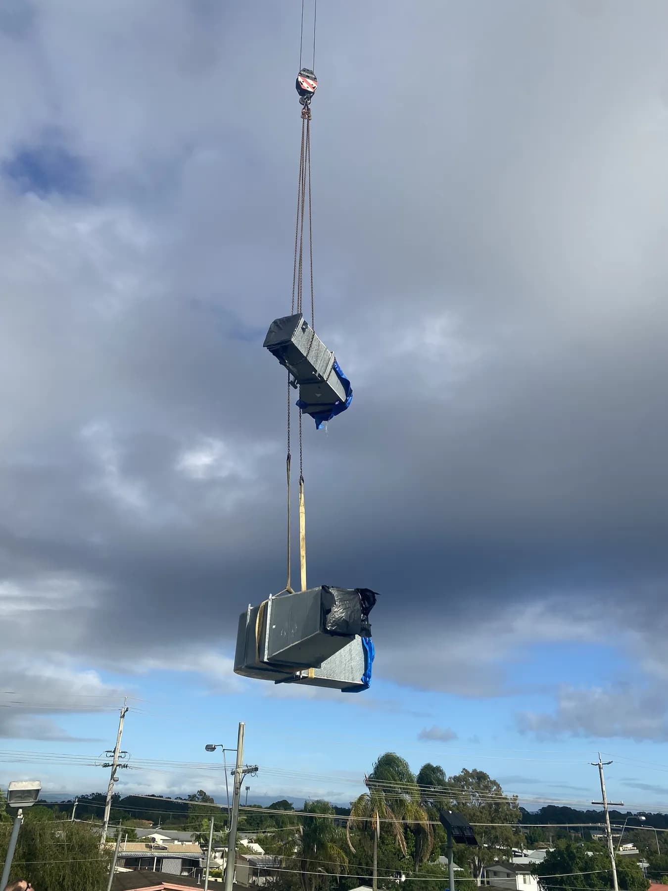 60T crane lifting roofing materials onto the Kippa-Ring car showroom roof