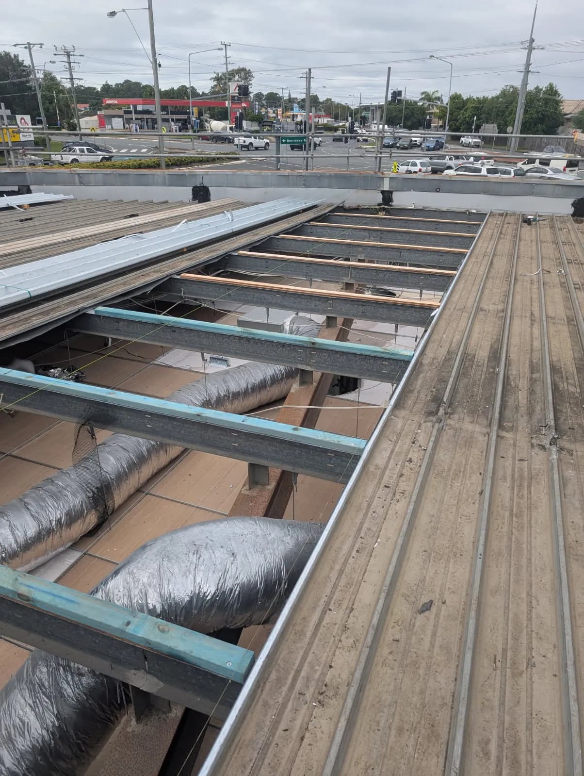 Timber diminishing furring set to achieve the roof fall at the Kippa-Ring car showroom