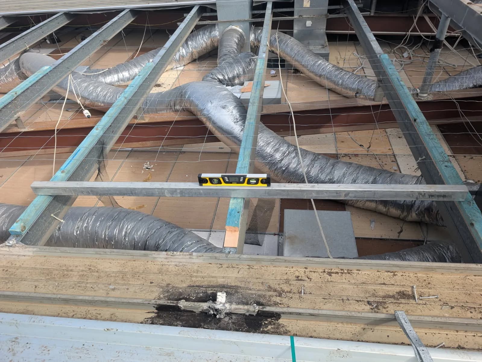 Timber diminishing furring set to achieve the roof fall at the Kippa-Ring car showroom