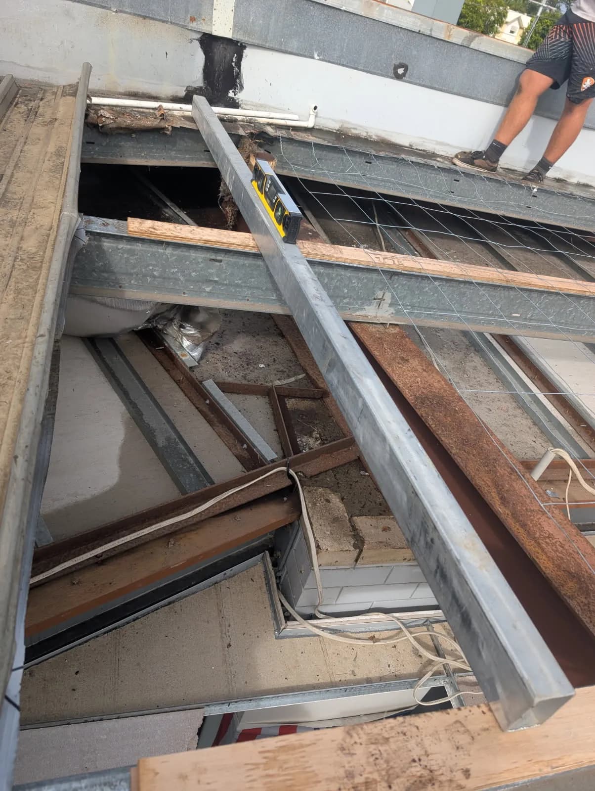 Timber diminishing furring set to achieve the roof fall at the Kippa-Ring car showroom