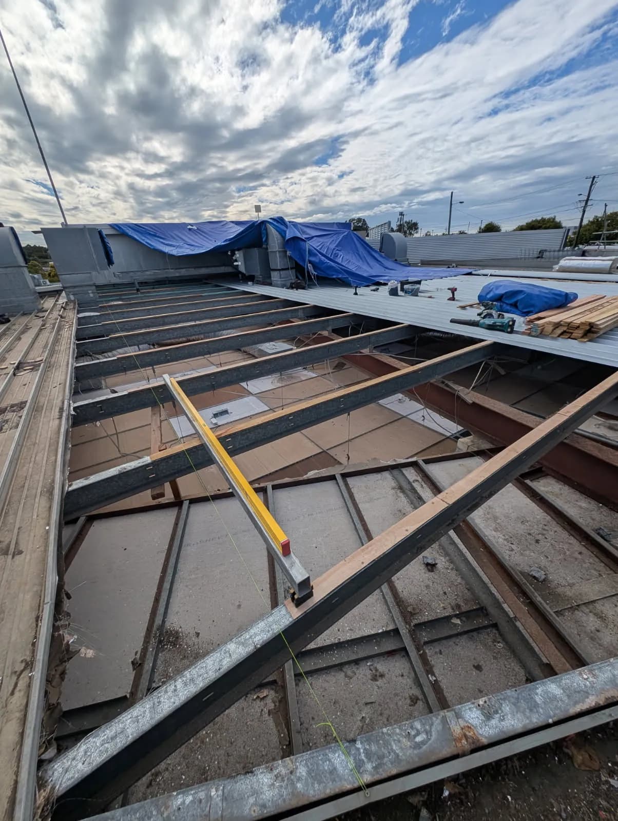 Timber diminishing furring set to achieve the roof fall at the Kippa-Ring car showroom