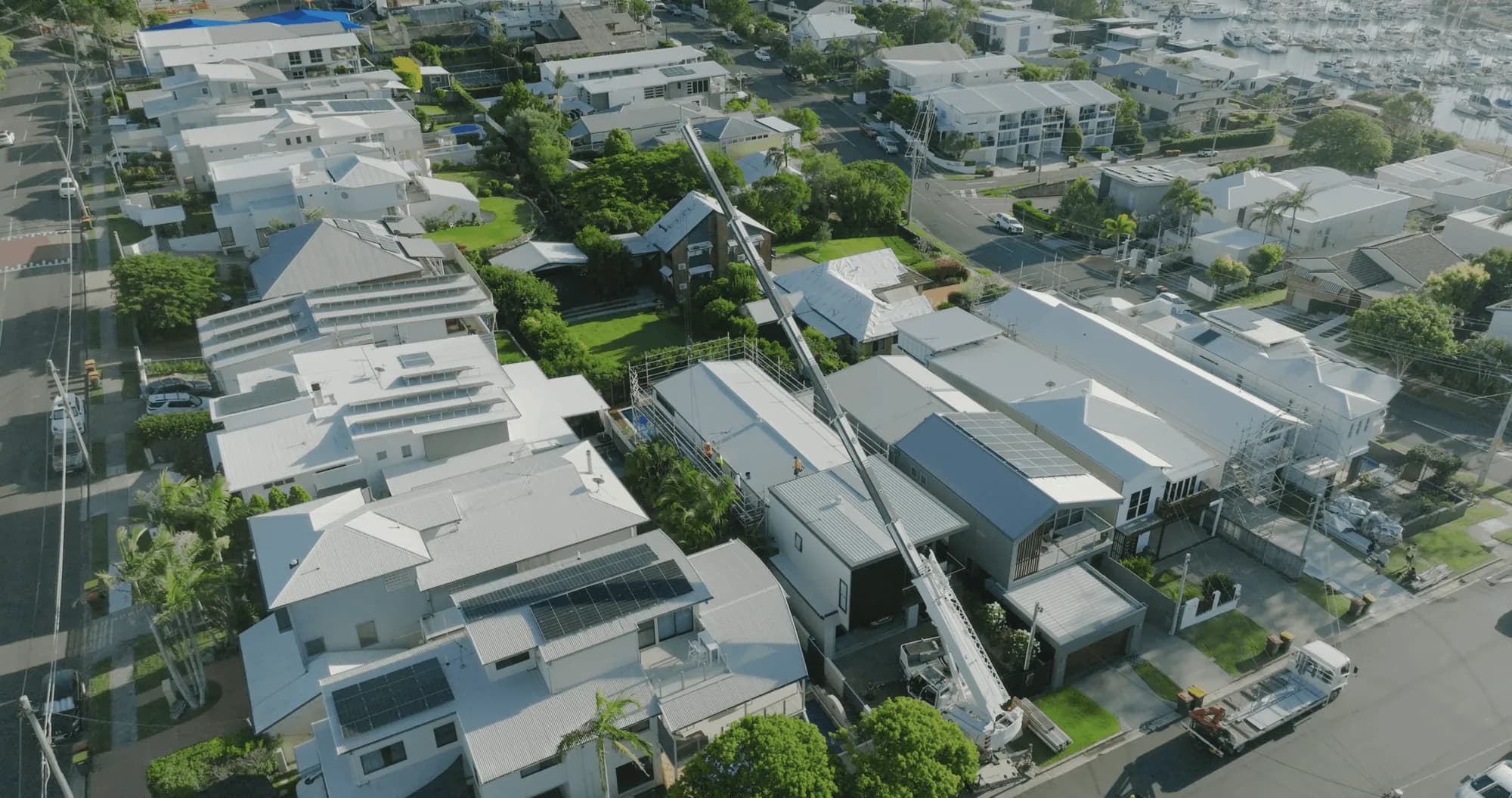 Aerial view of the Manly roof replacement with the crane on site