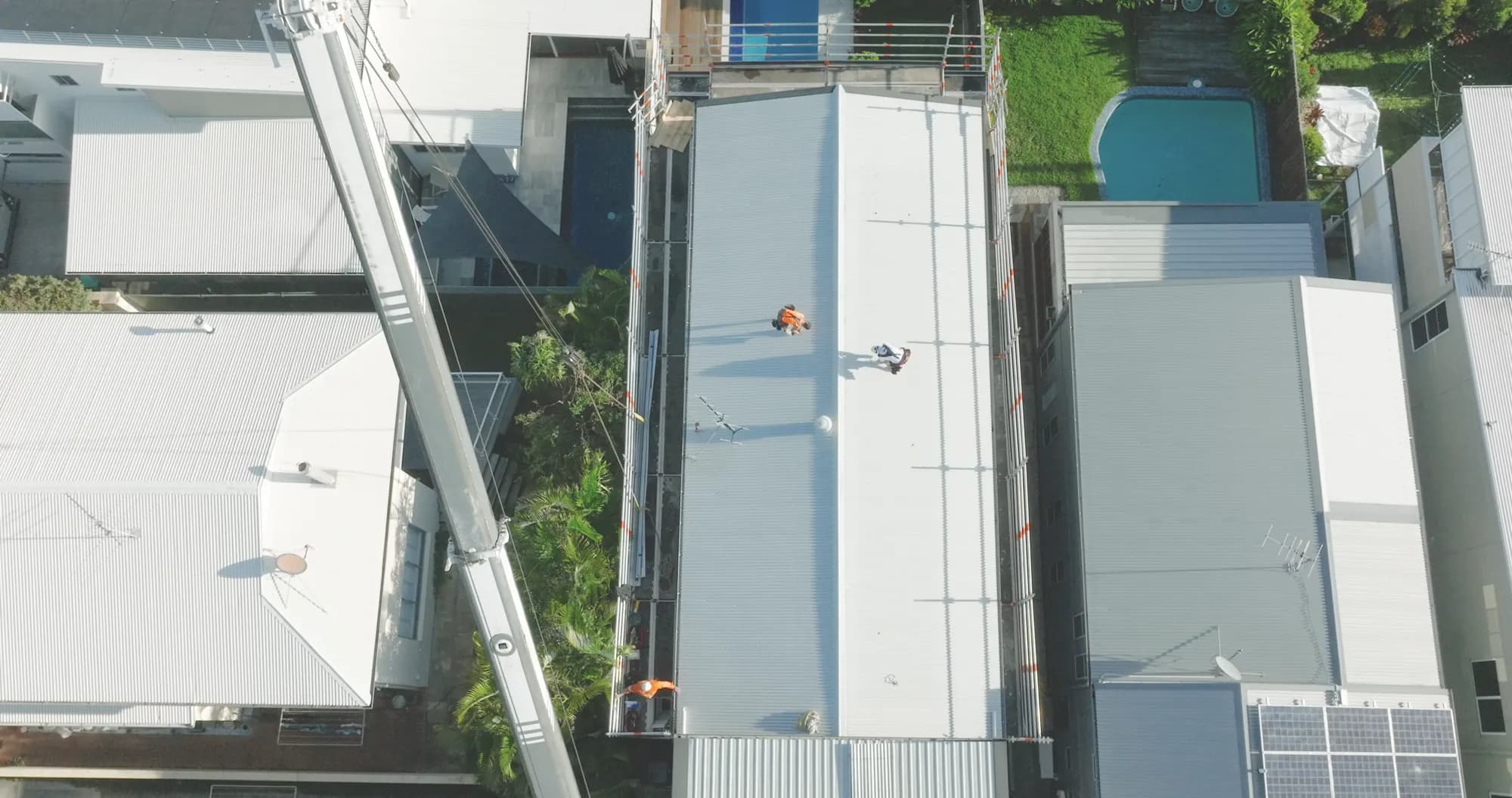 Aerial view of the Manly roof replacement with the crane on site