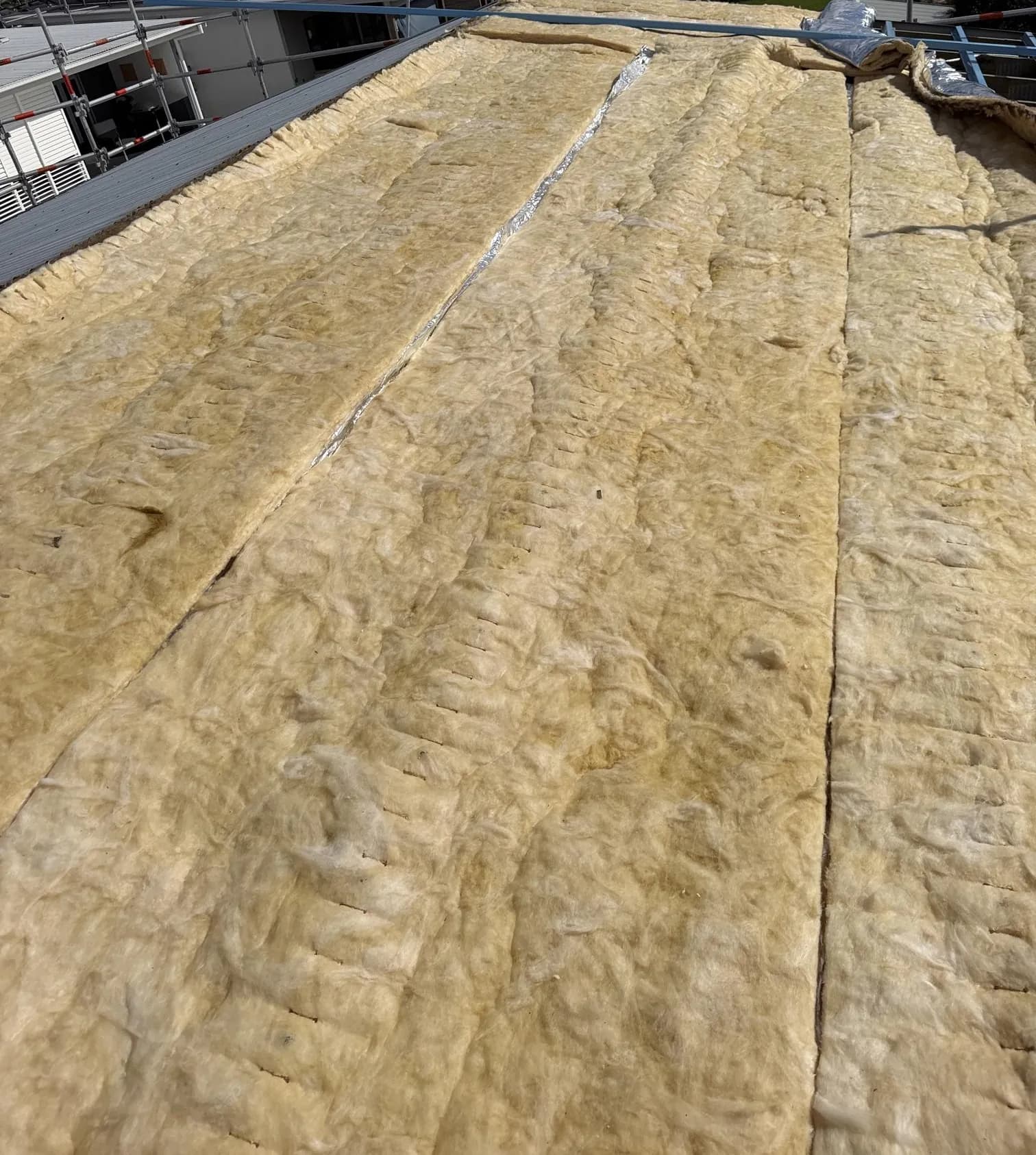 Roof replacement in progress at the Manly project