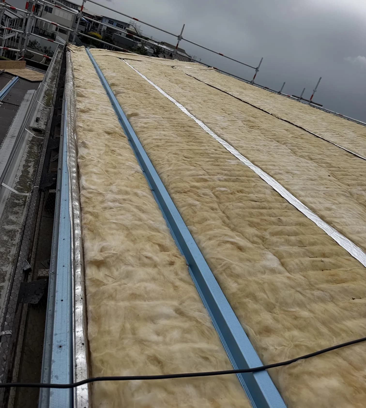 Roof replacement in progress at the Manly project