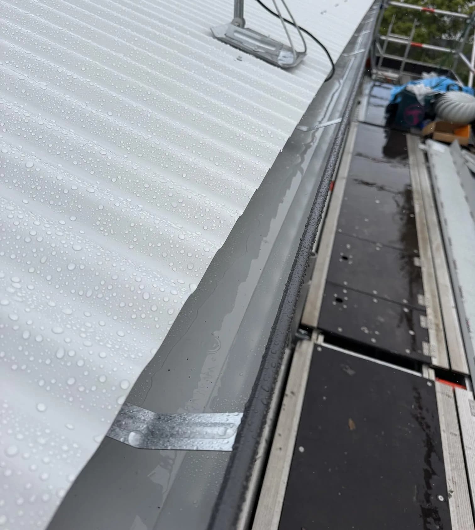 Roof replacement in progress at the Manly project