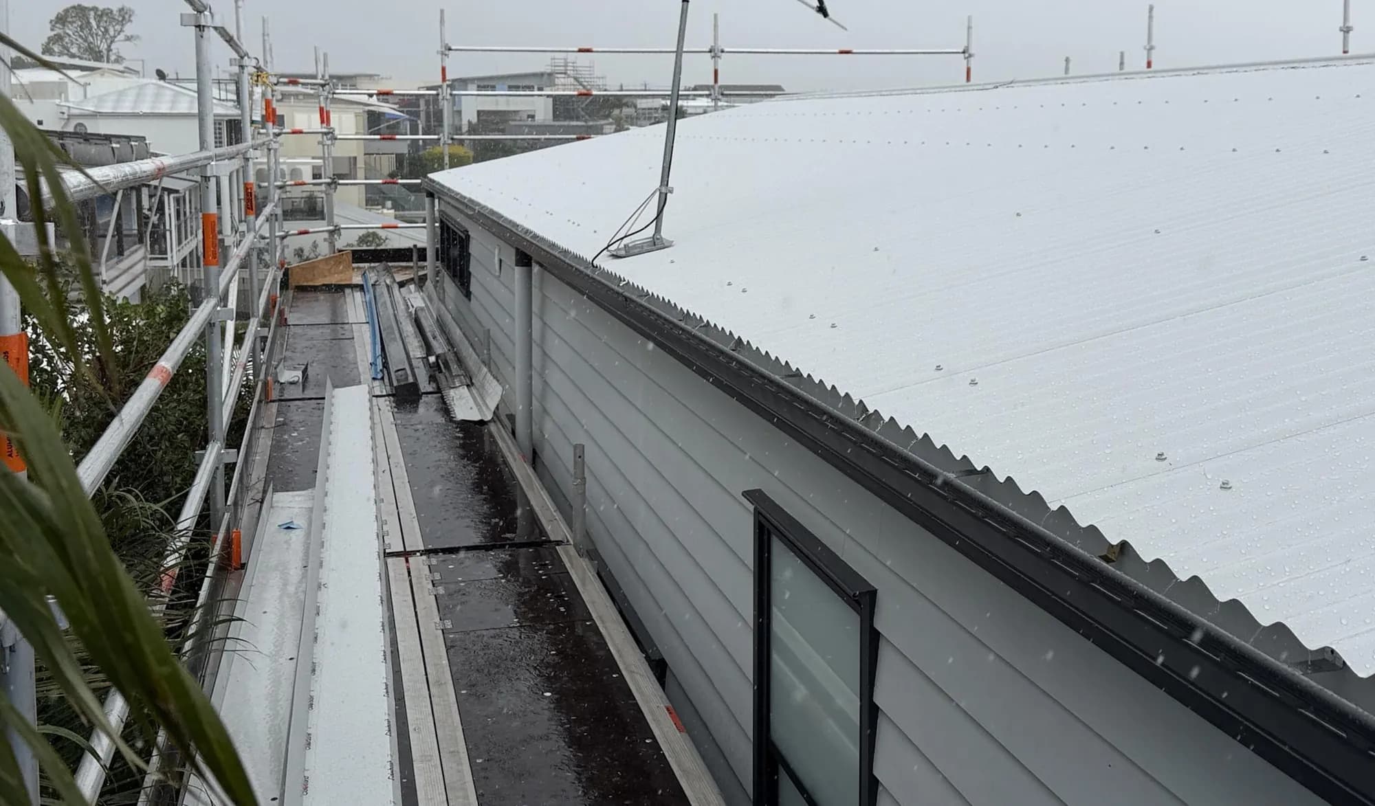 Roof replacement in progress at the Manly project