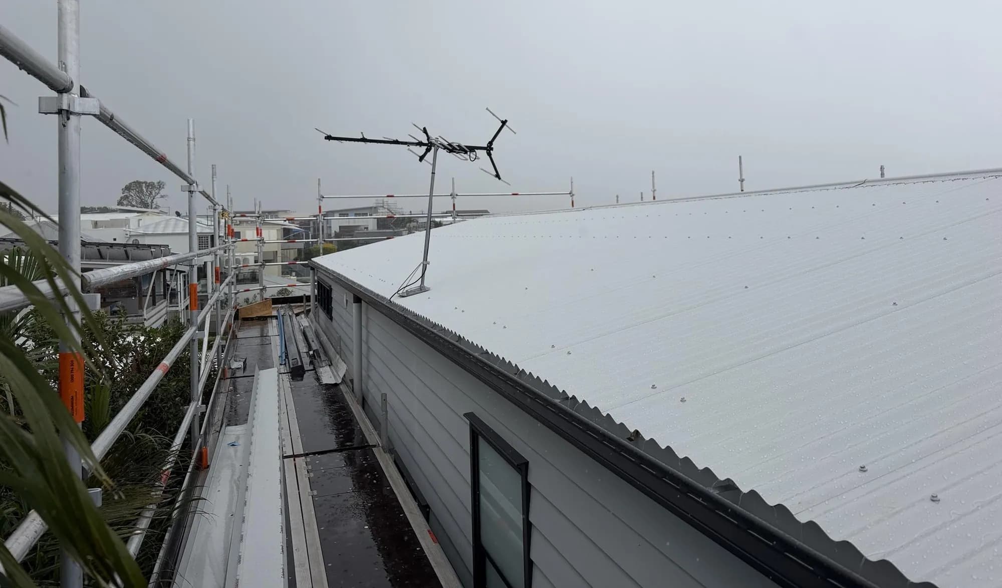 Roof replacement in progress at the Manly project