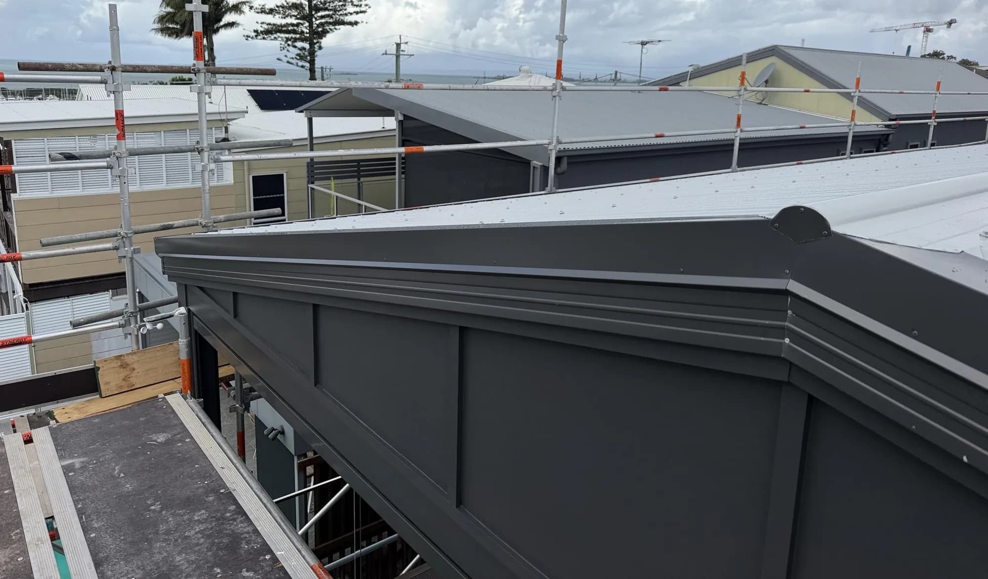 Roof replacement in progress at the Manly project