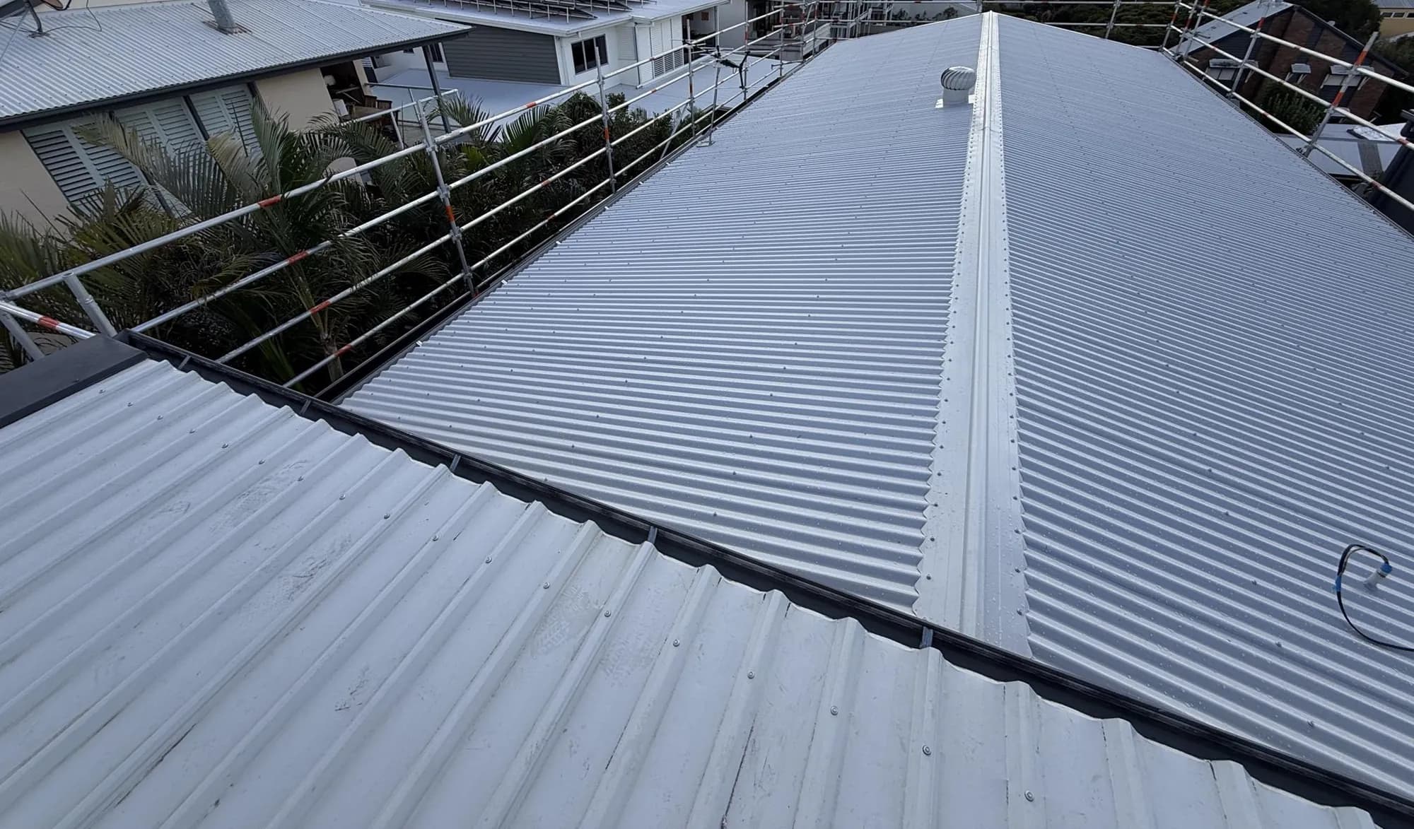 Roof replacement in progress at the Manly project