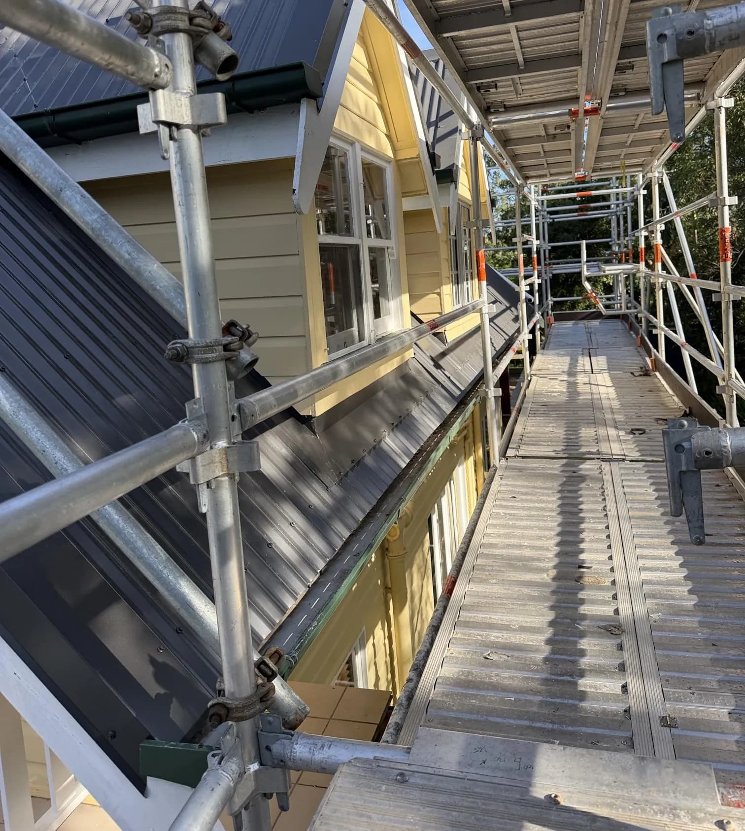 Decromastic tile and dormer roof replacement in progress at Waterford West
