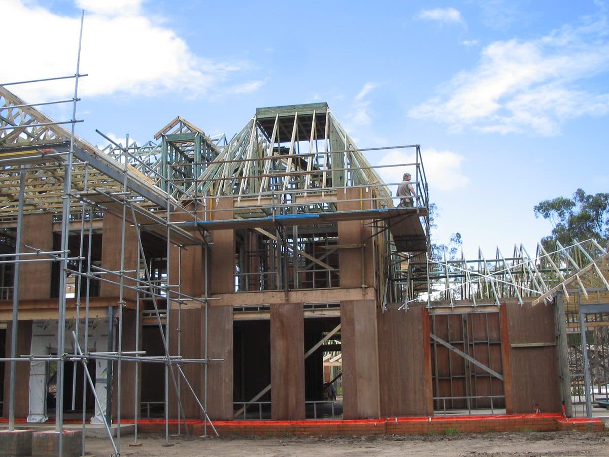A custom designed roof for a luxury home being installed